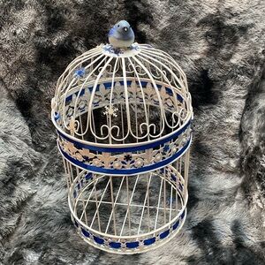 White  Wrought Iron Birdcage
Decorative Hinged Bird Embellished with blue bird